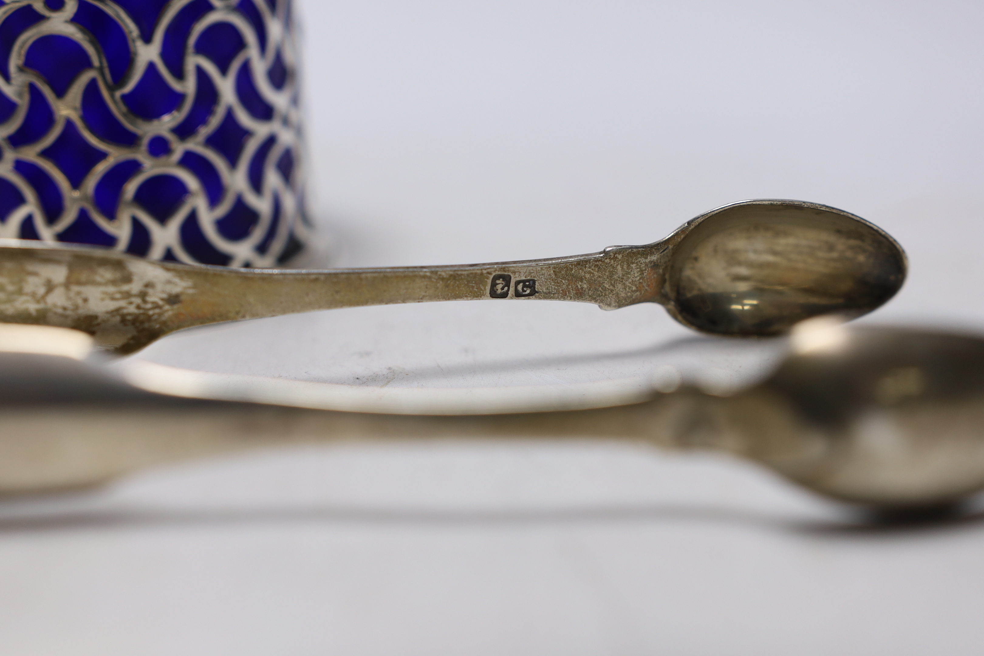 A Victorian pierced silver drum mustard pot, Charles & George Fox, London, 1854, a pair of 19th century Scottish provincial silver fiddle pattern sugar tongs, by David Gray of Dumfries, circa 1825 and a mother of pearl m